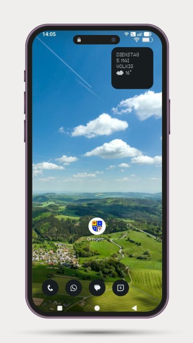 Ein Smartphone-Bildschirm zeigt den Startbildschirm eines Android-Geräts mit einem Landschaftshintergrund aus sanften grünen Hügeln, Wäldern und einem kleinen Dorf (Jammelshofen) unter blauem Himmel mit Wolken. Im unteren Drittel befindet sich ein einzelnes App-Icon mit einem viergeteilten Wappen der Ortsgemeinde Kaltenborn.